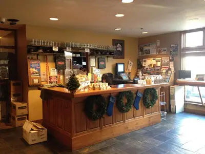 a store with a counter with christmas decorations on it at Howe Sound Inn & Brewing Company in Squamish