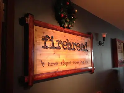 a sign that says friend and a house sound breaking up at Howe Sound Inn & Brewing Company in Squamish