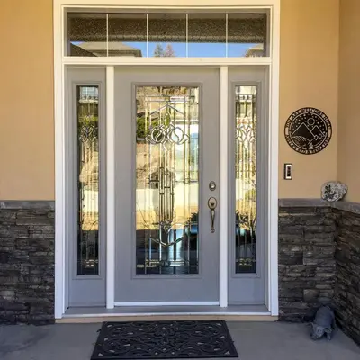 a white front door of a home with glass at Adela's Bed and Breakfast in West Kelowna