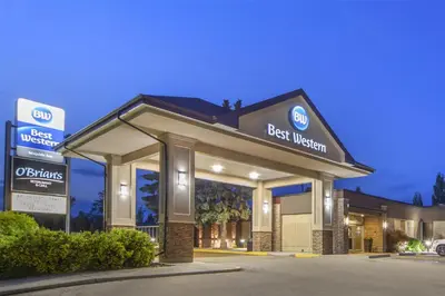 a best western building with a best western sign at Best Western Wayside Inn in Wetaskiwin