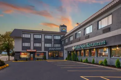 a rendering of the front of a building at Days Inn by Wyndham Terrace in Terrace