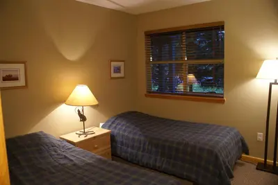 a hotel room with two beds and a window at Whistler Superior Properties in Whistler
