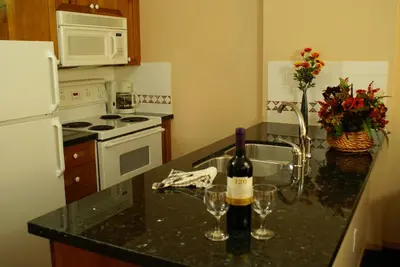 a kitchen with a bottle of wine on a counter at Whistler Superior Properties in Whistler