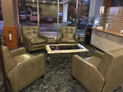 a group of chairs and a table in a store at St. Albert Inn & Suites in St. Albert