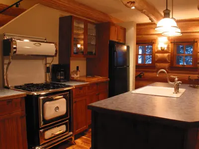 a kitchen with a stove and a sink at Snow Creek Cabins by Fernie Lodging Co in Fernie