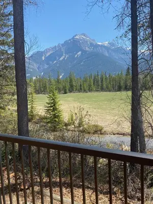 a view of a mountain from the porch of a house at Rocky Mountain Cabins and Home in Golden