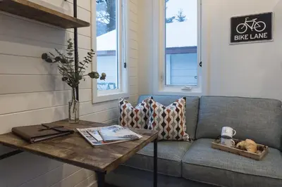 a living room with a couch and a table at Snow Valley Lodging in Fernie