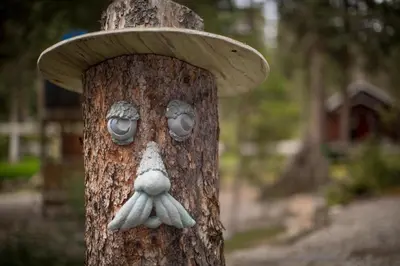 a tree with a mushroom on top of it at Paradise Lodge and Bungalows in Lake Louise