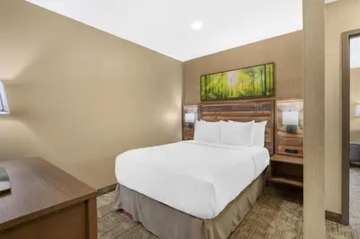 a hotel room with a bed and a desk at Best Western Plus Valemount Inn & Suites in Valemount