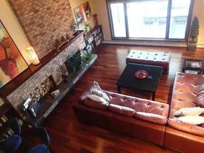 a living room with a couch and a table at A View of the Lake B & B in West Kelowna