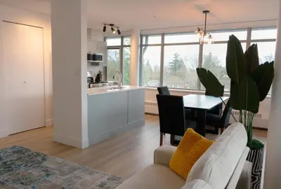 a living room with a couch and a table at Carey Centre on UBC campus in Vancouver