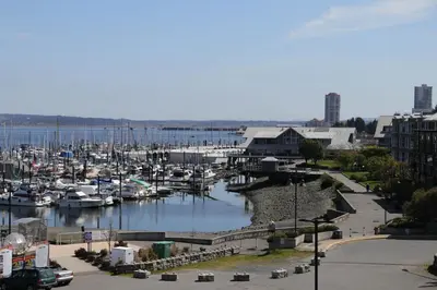 a marina with many boats in the water at The Waterfront Suites and Marina in Nanaimo