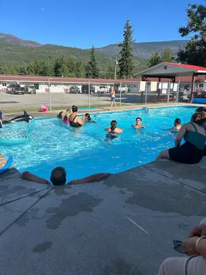 a group of people in a swimming pool at Paradise Motel in Sicamous