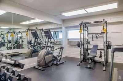 a gym with treadmills and elliptical machines at Days Inn & Conference Centre by Wyndham Camrose Norsemen in Camrose