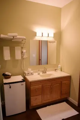 a bathroom with a sink and a mirror at Baergnaescht B&B in Osoyoos