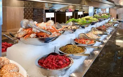a buffet line with many different types of food at River Rock Casino Hotel in Richmond