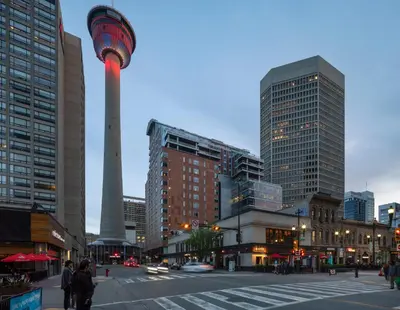 a city with a tower in the middle of a street at Hotel Le Germain Calgary in Calgary