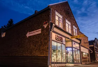 a store front of a brick building at night at Riding Fool Accommodation in Cumberland