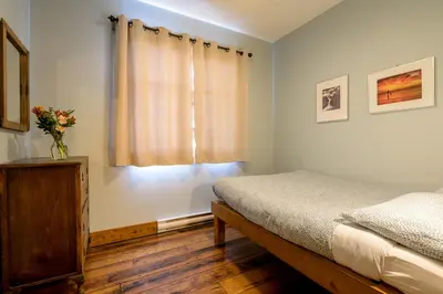 a bedroom with a bed and a window at Riding Fool Accommodation in Cumberland