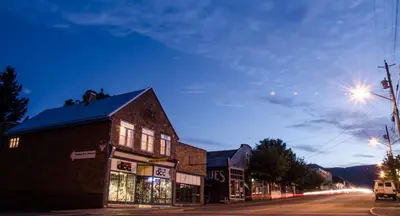 a building on the side of a street at night at Riding Fool Accommodation in Cumberland