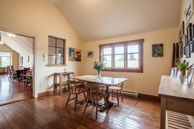 a dining room with a table and chairs at Riding Fool Accommodation in Cumberland