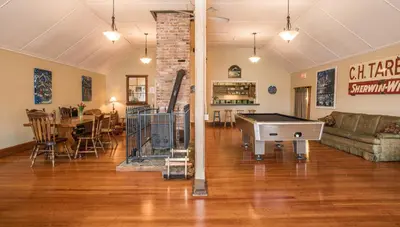 a living room with a pool table in the middle of it at Riding Fool Accommodation in Cumberland