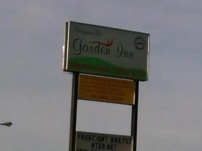 a sign for a restaurant on the side of the road at Vegreville Garden Inn in Vegreville