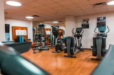 a gym with several treadmills and exercise bikes at Red Deer Resort & Casino in Red Deer