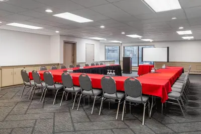 a conference room with a long table and chairs at Sternwheeler Hotel & Conference Centre, Trademark by Wyndham in Whitehorse
