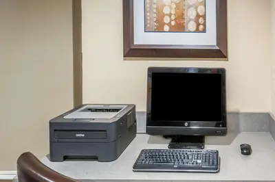 a computer and printer sitting on a desk at Super 8 by Wyndham Calgary/Airport in Calgary