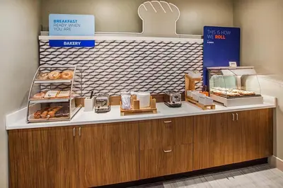 a bakery with a counter with donuts on it at Holiday Inn Express Hotel & Suites - Slave Lake by IHG in Slave Lake