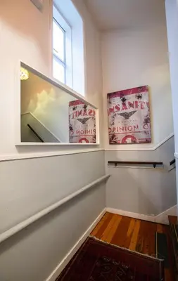 a room with two posters on the wall and a window at The Cambie Hostel Seymour in Vancouver