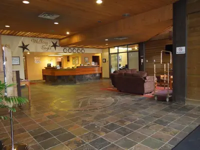 a lobby with couches and a waiting room at Walking Eagle Inn & Lodge in Rocky Mountain House