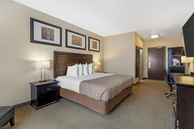 a hotel room with a bed and a desk at Best Western Plus St Albert in St. Albert
