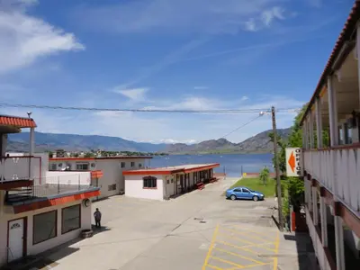 a view of the water from a building at Spanish Fiesta Resort in Osoyoos