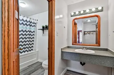 a bathroom with a sink and a mirror at Samesun Banff Hostel in Banff