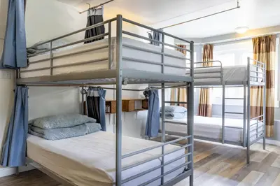 a bedroom with bunk beds in a hostel at Samesun Banff Hostel in Banff
