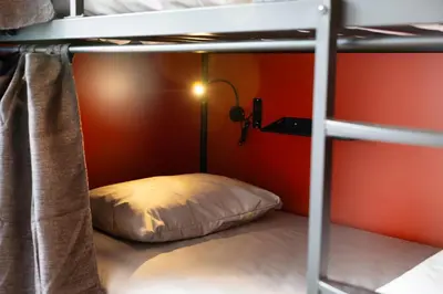 a bunk bed with a pillow in a room at Samesun Vancouver in Vancouver