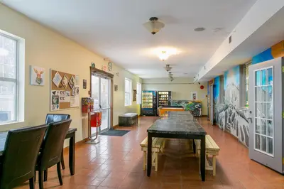 a dining room with a table and chairs at HI Kelowna Hostel in Kelowna