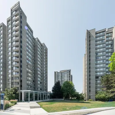 two tall buildings in a city with a park at Gage Suites at UBC in Vancouver