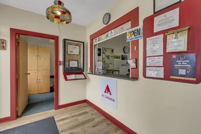 a waiting room with a sign on a wall at HI Penticton - Hostel in Penticton
