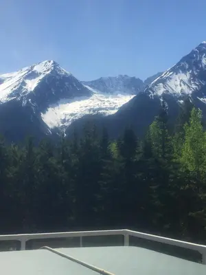 a view of a snow covered mountain from a building at Silvern Lake Trail Bed and Breakfast in Smithers