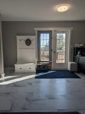 a living room with a door open to a balcony at The Ranch Highway 55 in Debden