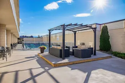 a patio with a gazebo with furniture on it at Days Inn by Wyndham Cranbrook Conference Centre in Cranbrook