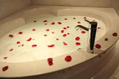 a sink with red rose petals in it at Century Casino & Hotel Edmonton in Edmonton