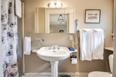 a bathroom with a sink and a toilet at O Canada House Bed & Breakfast in Vancouver