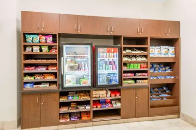 a refrigerator filled with lots of food and drinks at Ramada by Wyndham Olds in Olds