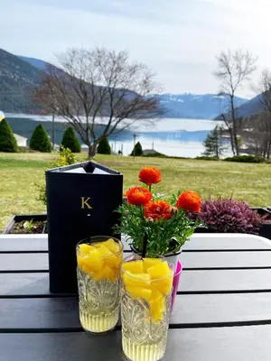 two vases with flowers and a box on a table at Kokanee Glacier Resort in Nelson