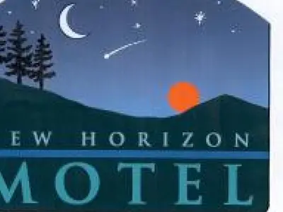 a book cover of a wolf horizons moron sign at New Horizon Motel in Christina Lake