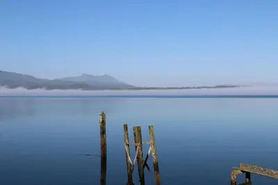 a dock in the middle of a body of water at Nimpkish Hotel in Alert Bay